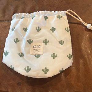 Cactus makeup bag with brush sleeve and inside slots for makeup